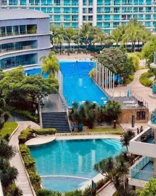 an aerial view of a swimming pool in a city at Azure Urban Resort Residences Paranaque Near Airport and Mall in Manila