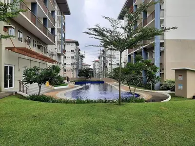 a small pond in the middle of a building at The Little Abode Nuvali - Smart Studio Unit with Balcony & free pool access in Calamba