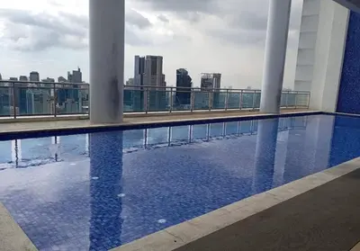 a swimming pool on the roof of a building at Stars & Sunsets Sky Views 1br Iguazu Tower in Manila