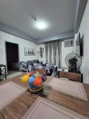 a living room with a couch and a table at SMT Condo Hotel in Manila