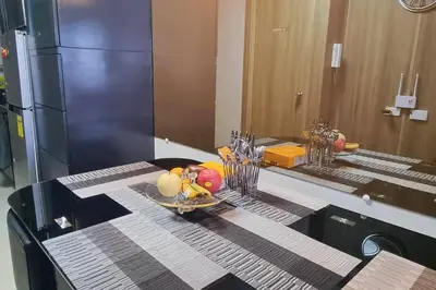 a table with a plate of fruit on a counter at Condo With Water Views in Manila