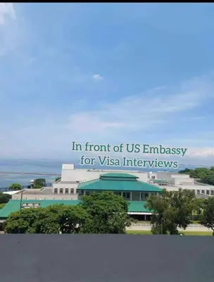 a sign that reads in front of us embassy for vtexas interagency at US Embassy, Cozy Condo, Ermita, Manila Roxas Blvd in Manila