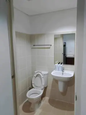 a bathroom with a toilet and a sink at US Embassy, Cozy Condo, Ermita, Manila Roxas Blvd in Manila