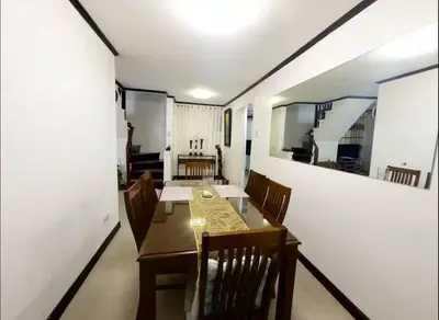 a dining room with a table and chairs and a mirror at Florie's Home in Santa Rosa
