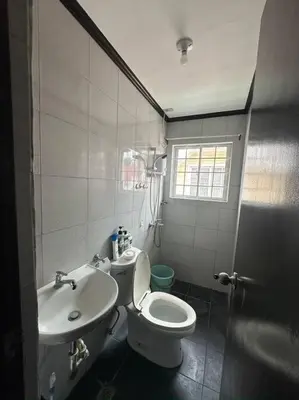 a bathroom with a toilet and a sink at Florie's Home in Santa Rosa
