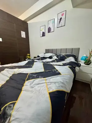 a bedroom with a large bed in a room at Air Residences 43rdF -By Soliel in Manila