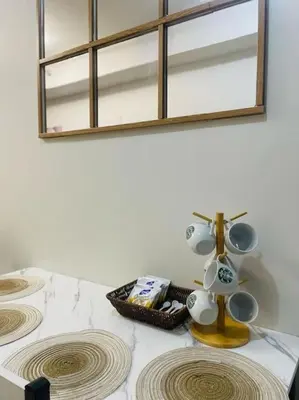 a table with two sinks and a lamp on it at Juliš Apartment S residence- Moa complex pasay in Manila