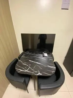 a table covered in tin foil in a room at Breeze Residences 26th floor in Manila