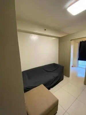 a room with a bed and a couch in it at Breeze Residences 26th floor in Manila