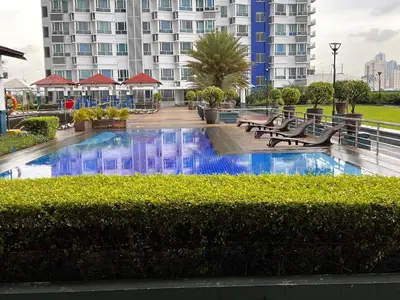 a swimming pool in the middle of a building at La Casa Benice in Manila
