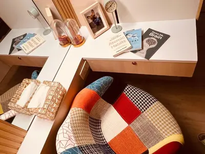a room with a desk with a pillow and a drawer at La Casa Benice in Manila