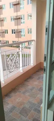 a balcony with a view of a building at The Roch in Manila