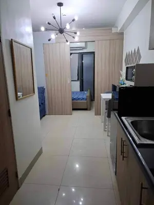 a room with a kitchen and a living room at Shore2 Residences in Manila