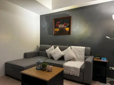 a living room with a couch and a table at 1BR Stay near NAIA Terminal 3 via Runway Manila in Manila