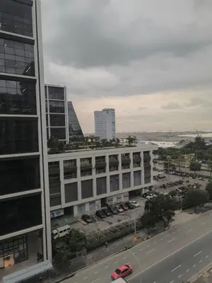 an aerial view of a building with a parking lot at Crib2Go Lupita Suite with City Street View in Manila