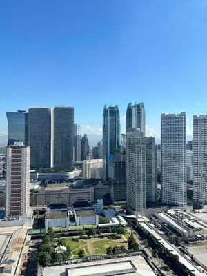 an aerial view of a city with tall buildings at El Romantico Staycation at Fame Residence in Manila