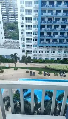 a view of the beach from the balcony of a building at Joie Selene in Manila