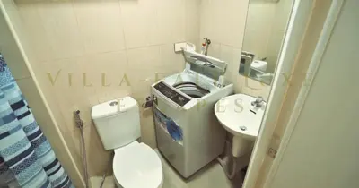 a small bathroom with a toilet and a sink at 1 Bed Room Shell Residence at Heart of Metro Manila - Pasay City in Manila