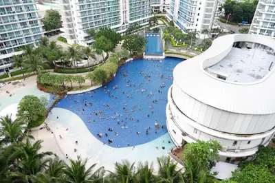 an overhead view of a swimming pool in a resort at Azure Urban Resort by Melrose Avenue in Manila