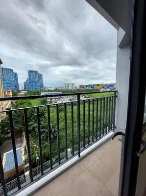 a balcony with a view of a city at Shore Residences in Manila