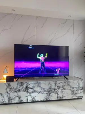 a flat screen tv sitting on top of a wall at Venetian Haven BGC Venice Grand Canal Apart ment, 4 Bedrooms, for 10 Guests in Manila