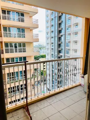 a balcony with a view of a building at Venetian Haven BGC Venice Grand Canal Apart ment, 4 Bedrooms, for 10 Guests in Manila