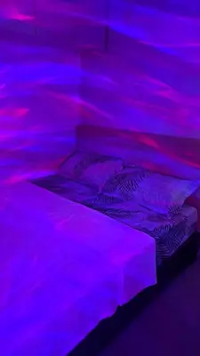 a bed in a room with purple lights at Searendipity - Sea Residences, Pasay City in Manila