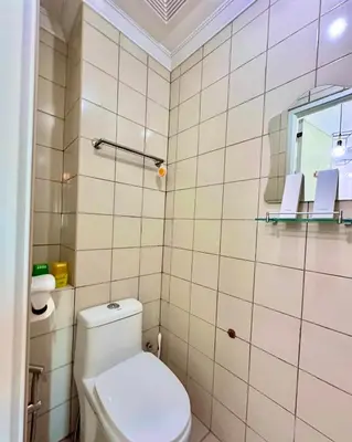 a small bathroom with a toilet and a mirror at Studio Two Condominium - Alabang, BLK - Northgate Cyberzone, Filinvest City, Alabang - Netflix-ready Fiber Wi-Fi in Manila