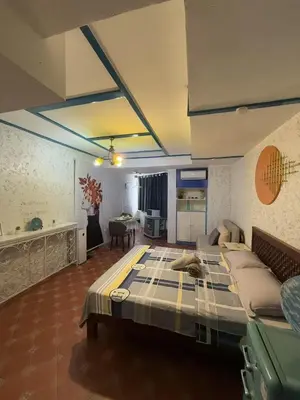a bedroom with a large bed in a room at Vincondotel Roxas Ave Manila 1BR Marbella in Manila