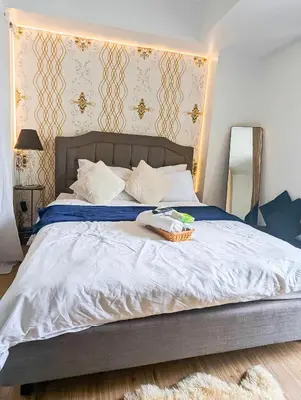 a bed with a basket on top of it at 1Bedroom Beach View with Netflix near Airport in Manila