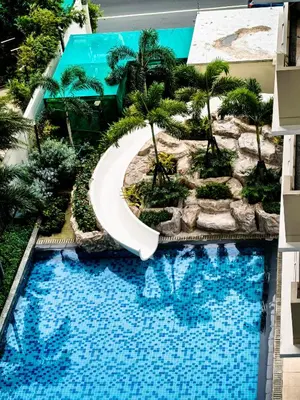 an overhead view of a swimming pool in a resort at Vincondotel Near BGC 3BR Fairlane in Manila