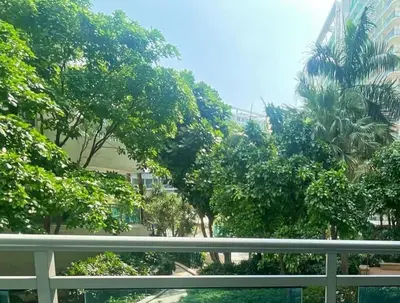 a view of a street with trees and a fence at Azure Urban Residences By Lyn 2BR in Manila