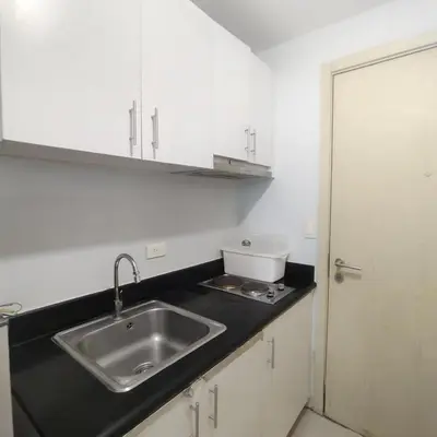 a kitchen with a sink and a counter top at Budget Family Group Room for 4 persons in Manila
