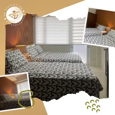 a bedroom with two beds at Deluxe Room with Balcony near MOA in Manila