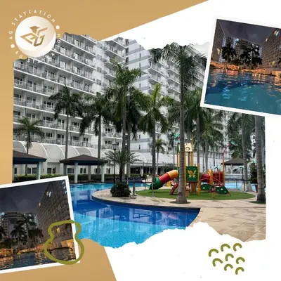 a picture of a resort pool with a slide at Deluxe Room with Balcony near MOA in Manila