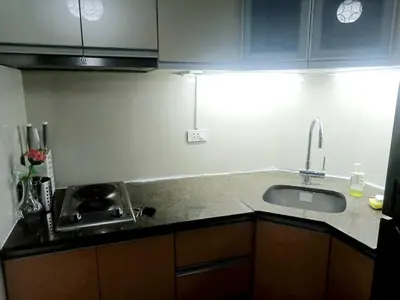 a kitchen with a sink and a counter top at Casa Antonio at 7i Two Palm Tree Villas Beside NAIA3 in Manila