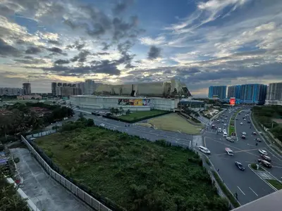 an aerial view of a city with traffic on a highway at Gentry Manor Balcony Sea View WiFi Netflix Near Airport Okada 8B in Manila