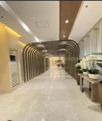 a hallway in a building with a tunnel at JL shore Staycation in Manila