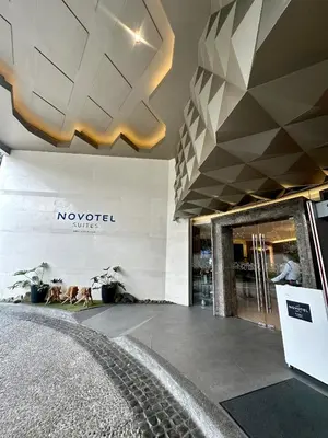 a shopping mall with a novation sign on the wall at Hotel Apartment Suite near Makati in Manila