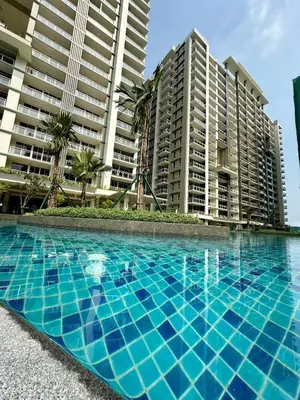 a swimming pool in front of some tall buildings at Condo in Taguig in Manila