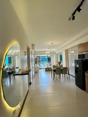 a kitchen and living room with a table and a dining room at Condo in Taguig in Manila