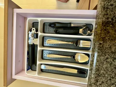 a drawer full of utensils in a box at Condo in Taguig in Manila