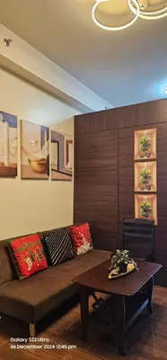 a living room with a couch and a table at Relaxing Chic Hotel Like with Manila Bay view in Manila