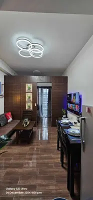 a living room with a couch and a table at Relaxing Chic Hotel Like with Manila Bay view in Manila