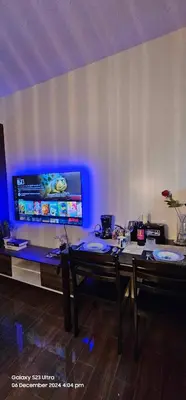 a dining room with two tables and a blue light at Relaxing Chic Hotel Like with Manila Bay view in Manila