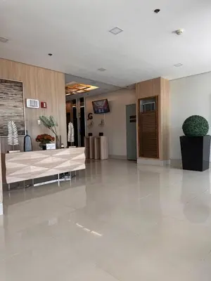 a lobby with a reception desk in a building at RKChillescapes in Manila