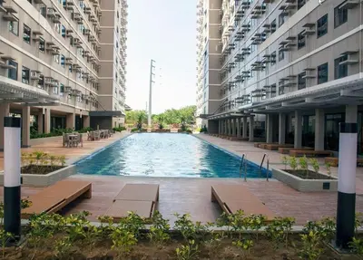 a swimming pool in the middle of a building at Green 2 - Gems Suite in Dasmariñas