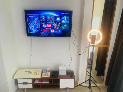 a flat screen tv hanging on a wall at Sole Sister Azure Staycation in Manila