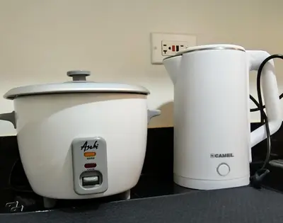 two appliances sitting on a counter next to each other at La Casa de Maria in Manila