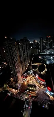 a city at night with a lot of traffic at Birch Tower Malate Manila by T&T in Manila